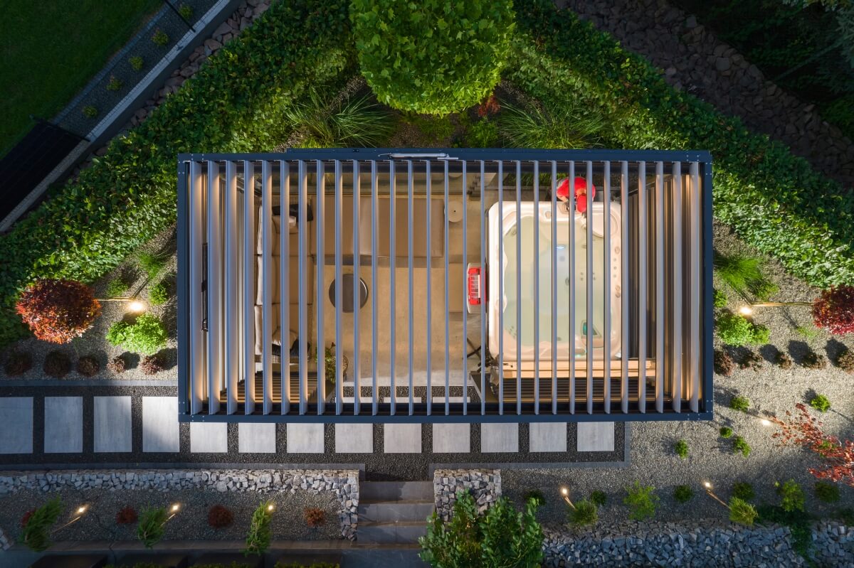 Aerial view of a garden structure housing a jacuzzi with enclosures from shutters.